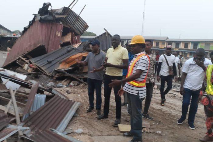 Cross River State Commissioner for Environment, Mr Mfon Bassey (right) during the demolition exercise (NAN)