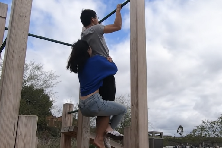 This Guy Trained to Do Pullups Holding His Wife
