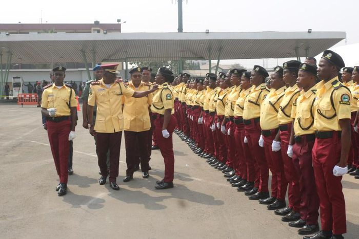 Gov. Babajide Sanwo-Olu of Lagos State adjusting the collar of one of the newly recruited officials of Lagos State Traffic Management Authority (LASTMA) during their passing out parade in Lagos on Wednesday (Twitter/@followlasg)