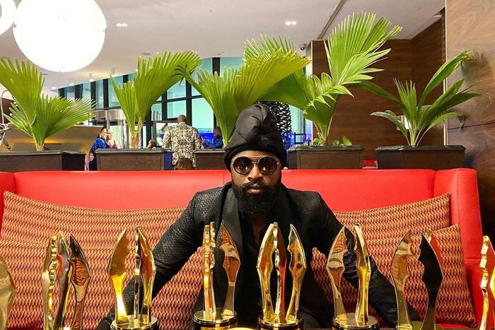 Charles Okpaleike poses with 'Living in Bondage' massive wins at the 2020 AMVCA [Instagram/ CharlesofPlay]