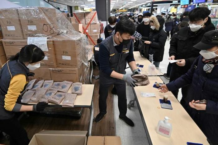 People buy face masks at a retail store in the southeastern city of Daegu, South Korea