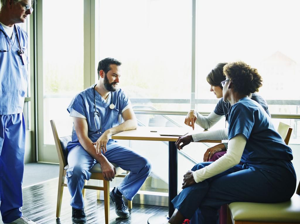 Medical team in discussion in employee lounge