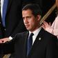 Venezuelan opposition leader Juan Guaido waves as he is acknowledged by US President Donald Trump during the State of the Union address