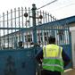 Worshippers clustered at the gate of Makoko's Celestial Church of Christ only to find policemen handing out fliers on the dangers of the virus