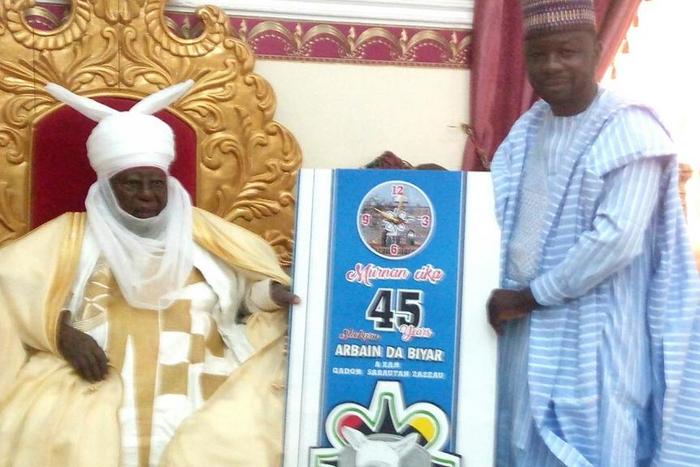 The Executive Chairman Kaduna State Internal Revenue Service Dr Zaid Ibrahim Right presenting a gift to the Emir of Zazzau. [NAN]