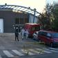 Policemen and undertakers wearing protective suits
stand outside the Palacio de Hielo (Ice Palace) in Madrid s