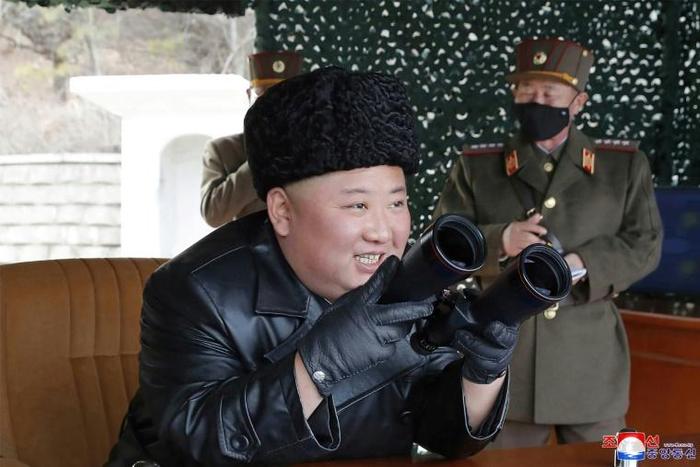 North Korean leader Kim Jong Un did not don a facemask to supervise the firing of what state media called a 'long-range artillery' drill