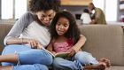 Mother and daughter reading a book [United Way]