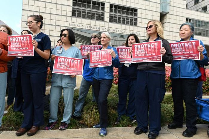 Nurses protest what they call the weak US response to the novel coronavirus outside the UCLA Medical Center in Los Angeles