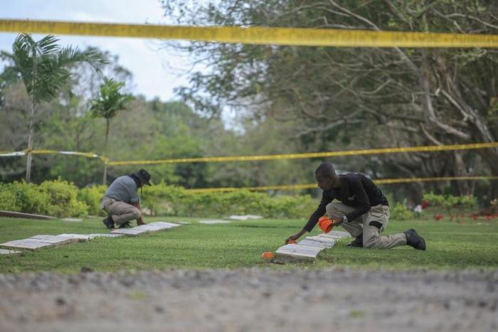 Forensic specialists begin working on exhuming the remains of people killed during the 1989 US invasion of Panama at the Jardin de Paz cemetery in Panama City, on January 20