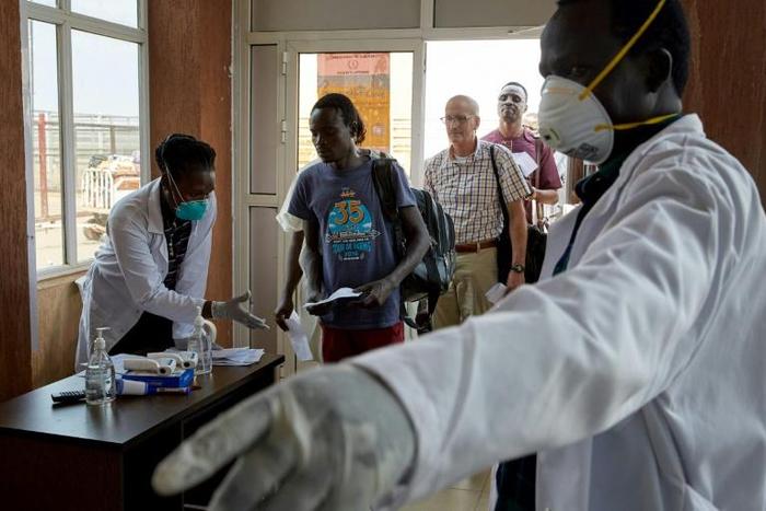 Passengers from an international flight being screened at Juba International Airport in South Sudan