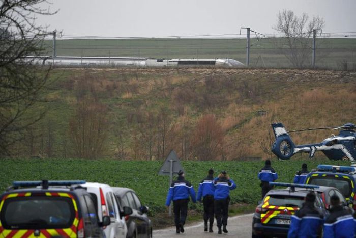Police at the site where a TGV train derailed near Ingenheim, eastern France, on Thursday.