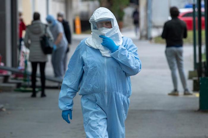 A health worker wears protective suit at the infectious disease clinic in Zagreb, Croatia, where the first coronavirus case in Croatia is hospitalized, Tuesday, Feb. 25, 2020. Croatia confirmed its first case of coronavirus in a man who had been to Mil...