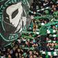 Supporters of Raja Club Athletic chant slogans and wave flags at a Moroccan football match between Raja and Mouloudia Oujda in January