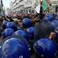 Algerian riot police block the progress of an anti-government demonstration heading towards the presidential palace in the capital Algiers, on Saturday