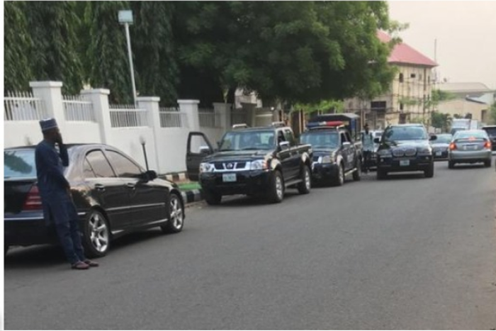 Police patrol vans at APC secretariat in Abuja on Wednesday after Adams Oshiomhole's suspension. (Punch)