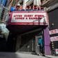 A homeless man walks by a closed theater in Los Angeles, on March 21, 2020, as California  grapples with its part of the global coronavirus pandemic