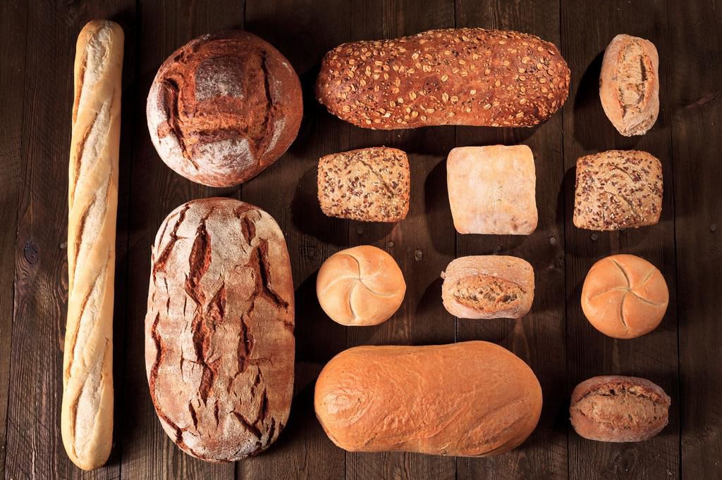 Bread and buns on wooden table, Bakeries