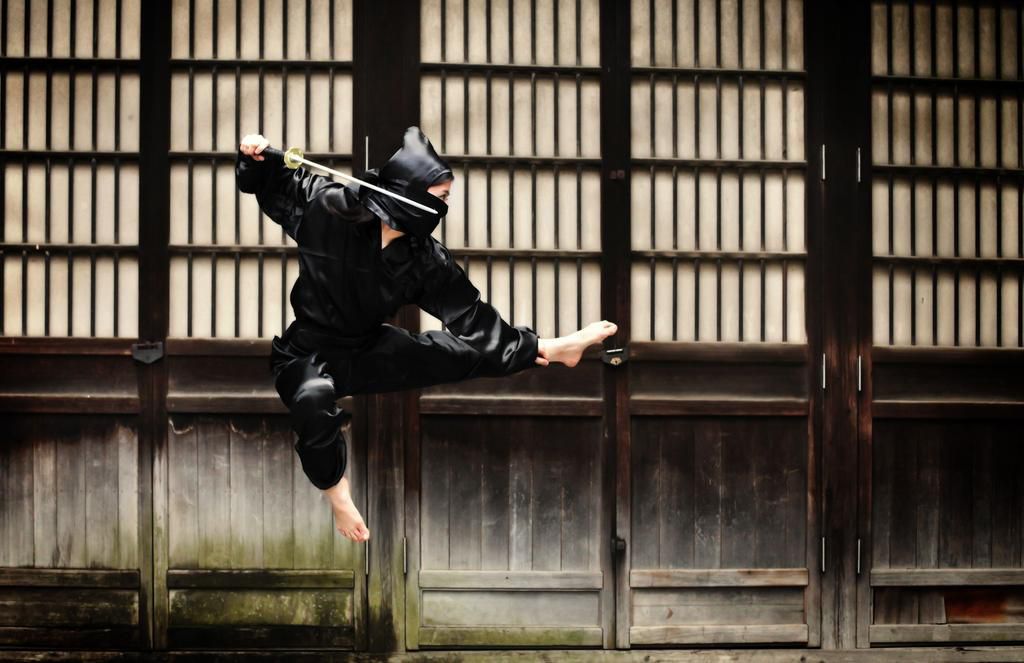 Asian woman showing her ninja moves