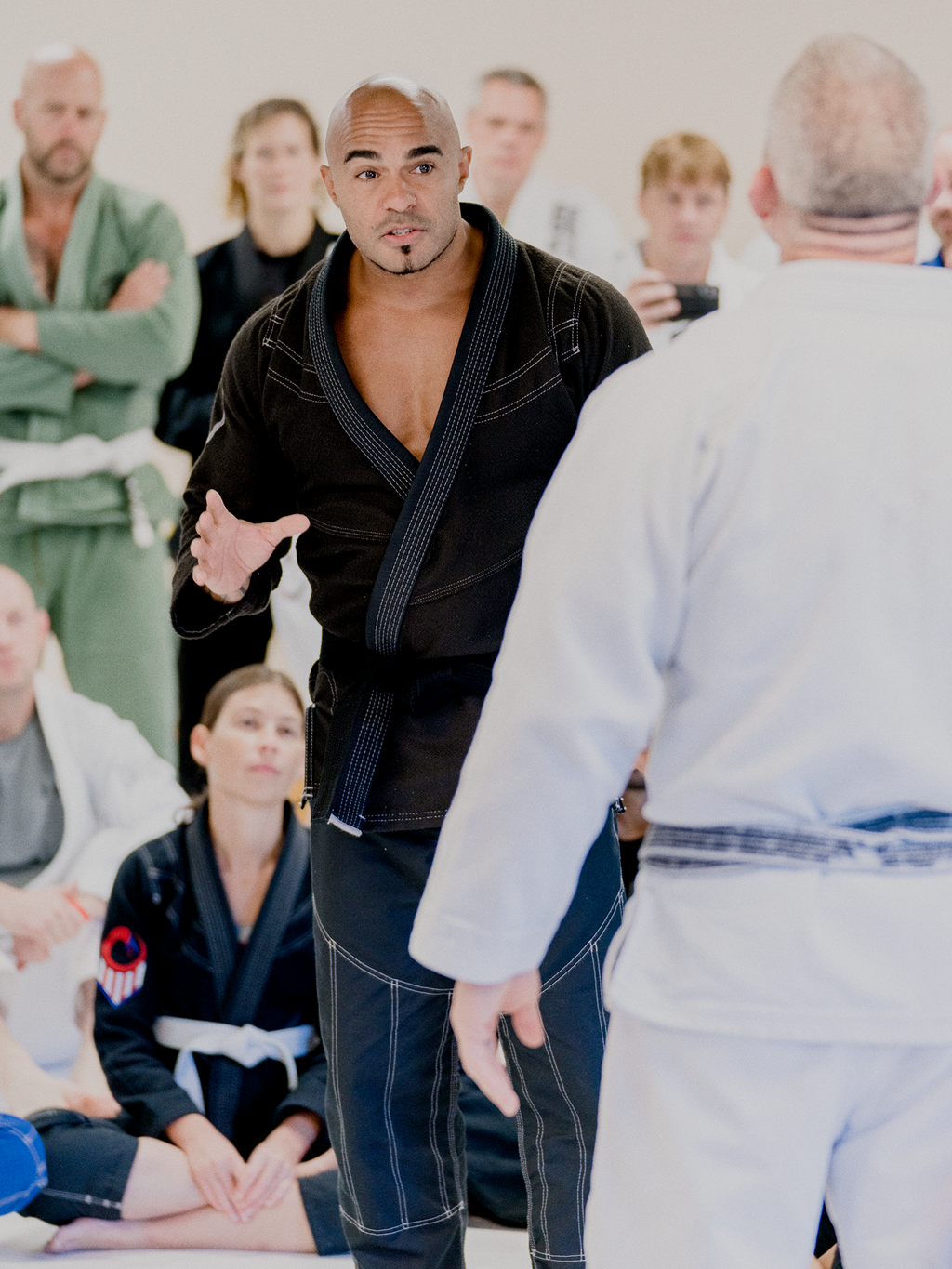 Instructors Echo Charles and Jocko share fight moves.