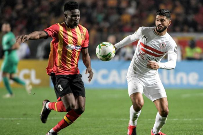 Midfielders Kwame Bonsu (L) of Esperance and Ferjani Sassi of Zamalek contest possession during a CAF Champions League quarter-final second leg in Tunis
