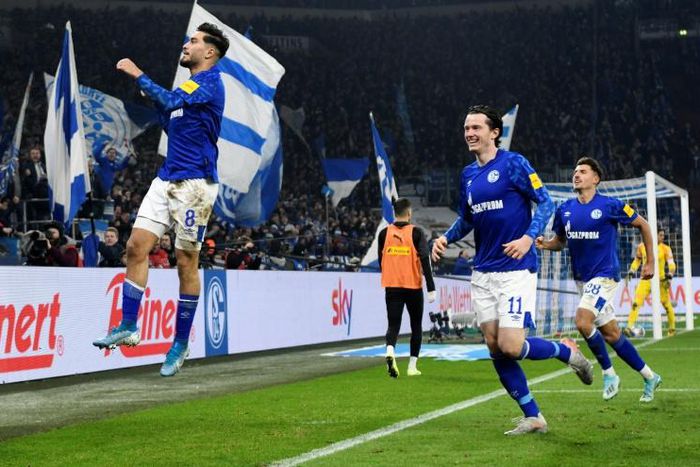 Schalke goalscorers Suat Serdar (L) and Michael Gregoritsch (2nd L) celebrate the opening goal in Friday's 2-0 win over Borussia Moenchengladbach