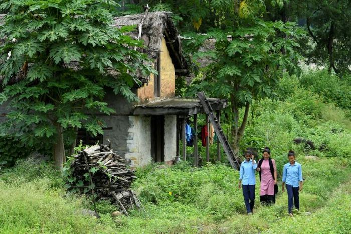 Asha Charti Karki (C), who got married at age 16, mentors young girls on the importance of education in a bid to tackle the growing numbers of teenagers who are marrying young by choice