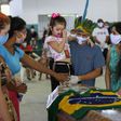 Members of the Parque das Tribos indigenous community mourn besides the coffin of Chief Messias of the Kokama tribe who died from COVID-19, in Manaus, Brazil. The country has nearly half of all cases recorded in Latin Ammerica and the Caribbean