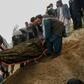 Mourners burying a victim of the militant attack on a Kabul hospital