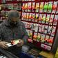 A salesman checks a floating fishing tackle for sale at a his store, after lockdown measures to fight COVID-19 were relaxed in Buenos Aires