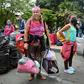 Venezuelan migrants loaded down with their belongins board a bus to go home, this time fleeing the new coronavirus