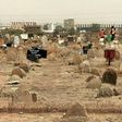 A picture taken on June 13, 2020, shows members of a forensic team at a cemetery where a mass grave of conscripts killed in 1998 was discovered, in the Sahafa neighbourhood, south of the Sudanese capital Khartoum