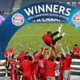 The Bayern Munich squad throw head coach Hansi Flick in the air after winning the Champions League final.
