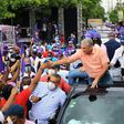 Ruling Dominican Liberation Party (PLD) candidate Gonzalo Castillo shakes hands with supporters in San Pedro de Macoris ahead vote
