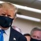 President Donald Trump makes a rare appearance in a mask as part of a new attempt to restore his standing with Americans over the handling of the coronavirus pandemic