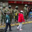 Ecuadorean soldiers wearing facemasks take part in a coronavirus public education operation in the capital, Quito