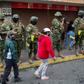 Ecuadorean soldiers wearing facemasks take part in a coronavirus public education operation in the capital, Quito