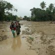 More than 14,000 people on the island of Sulawesi have been left homeless after flash floods engulfed thousands of houses in mud