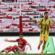 Is there anybody there? Benfica's Moroccan midfielder Adel Taarabt protests during the Portuguese league match against CD Tondela in front of a wall of scarves in the absence of spectators