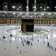 In this file photo taken on April 24, 2020, sanitation workers disinfect the area around the Kaaba in Mecca's Grand Mosque. On Monday Saudi Arabia said it will hold a 'limited' hajj this year due to the coronavirus pandemic