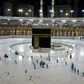 In this file photo taken on April 24, 2020, sanitation workers disinfect the area around the Kaaba in Mecca's Grand Mosque. On Monday Saudi Arabia said it will hold a 'limited' hajj this year due to the coronavirus pandemic
