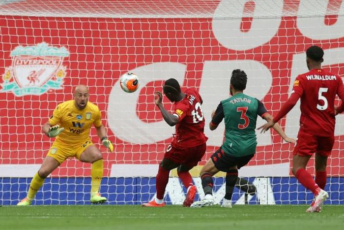 Senegalese Sadio Mane (C) scores the opening goal for Liverpool in a 2-0 win over Aston Villa at Anfield