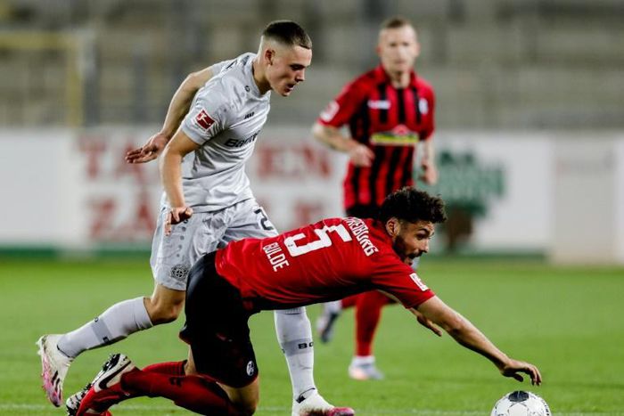 Record breaker: Florian Wirtz (left) in action against Freiburg last month