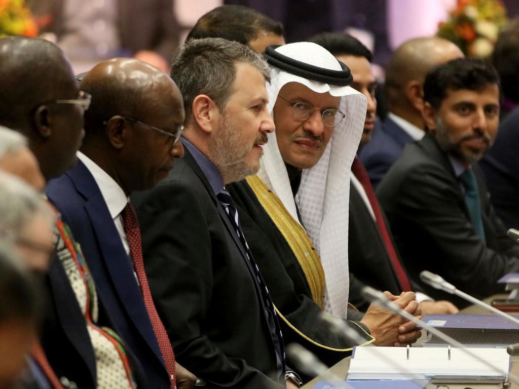 Prince Abdulaziz bin Salman Al-Saud, center, Minister of Energy of Saudi Arabia looks prior to the start of a meeting of the Organization of the Petroleum Exporting Countries, OPEC, at their headquarters in Vienna, Austria, Thursday, Dec. 5, 2019. (AP ...