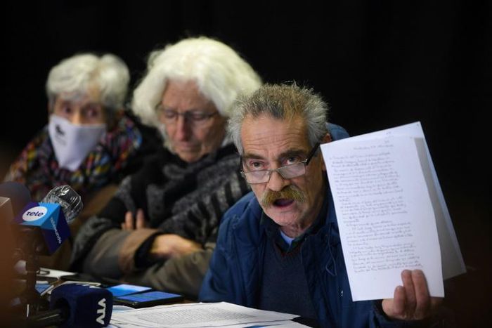 Ignacio Errandonea, member of Madres y Familiares de Desaparecidos organization, holds part of a copy of an Army's honor court document about retired Colonel Gilberto Vazquez, in prison for human rights abuses during the 1973-1985 dictatorship in Urugu...