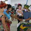 Indigenous from the Parque das Tribos community mourn besides the coffin of Chief Messias, 53, of the Kokama tribe who died victim of the new coronavirus, COVID-19, in Manaus, Brazil, on May 14, 2020