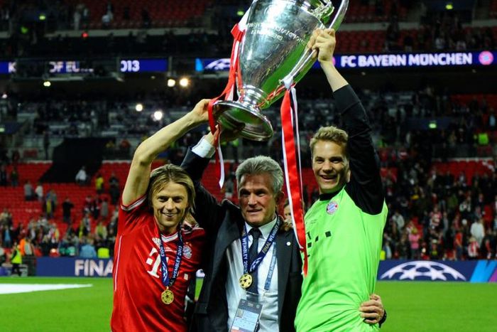 Current Bayern Munich captain Manuel Neuer (R) lifts the Champions League trophy alongside former coach Jupp Heynckes (C) after the 2013 final in London.