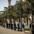 Worshippers wearing facemasks attended Friday prayers at Johannesburg's Nizamiye Mosque after the government said religious services could resume from June 1