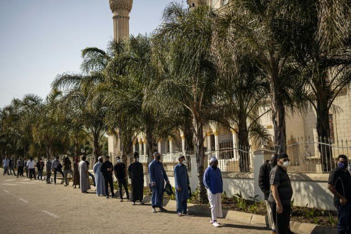 Worshippers wearing facemasks attended Friday prayers at Johannesburg's Nizamiye Mosque after the government said religious services could resume from June 1