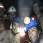 In this handout file photo released by Chile's mining ministry and taken on September 17, 2010, trapped Chilean miners pose inside the San Jose mine during their harrowing ordeal